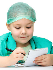 Image showing Cute little girl is playing doctor