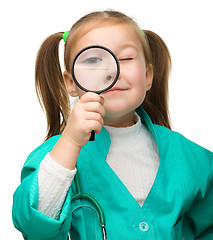 Image showing Little girl is playing doctor