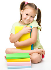 Image showing Cute little girl with books