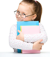 Image showing Cute little girl with books