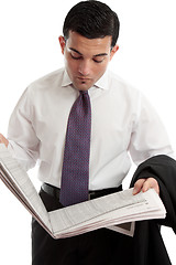 Image showing Businessman reading stocks and shares prices in newspaper