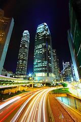 Image showing Traffic in city at night, it shows the busy business environment