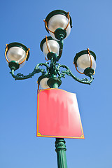 Image showing Green lamp under blue sky