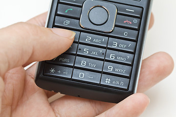 Image showing Hand using cellphone