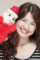 Image showing Christmas celebration by asian woman