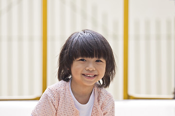 Image showing A young asian girl smiling