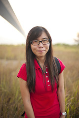 Image showing Asian girl smiling outdoor