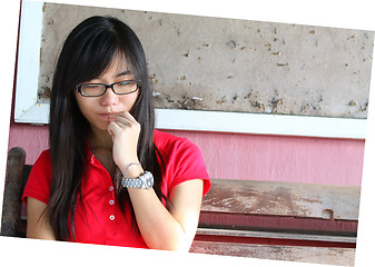 Image showing Asian girl thinking outside the classroom