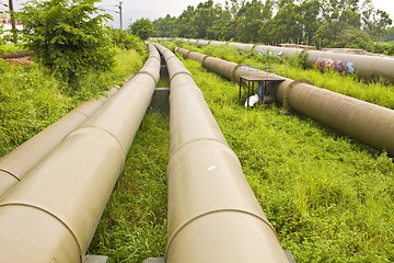 Image showing Industrial pipelines on the ground 
