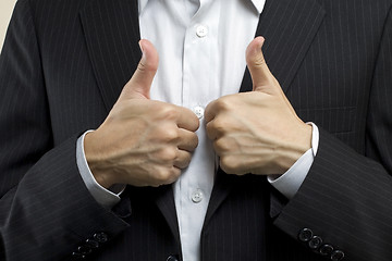 Image showing Business man with thumbs up, means successful deal.
