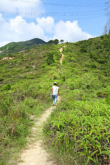 Image showing Woman hiking in mountains