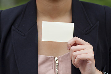 Image showing Asian woman holding a blank business card