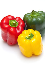 Image showing Bell peppers (green, yellow and red) isolated on white backgroun