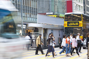 Image showing Busy pedestrian in business district, blurred motion. 