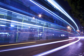 Image showing Light trails at night with busy traffic