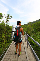 Image showing Asian man hiking on hiking trail 