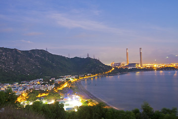 Image showing Power station along the seashore at night 