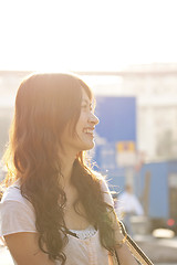 Image showing Asian woman similing under sunlight