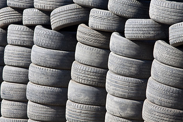 Image showing Many tyres and wheels under sunshine