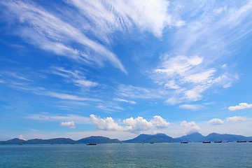 Image showing Landscape over the ocean with moving clouds