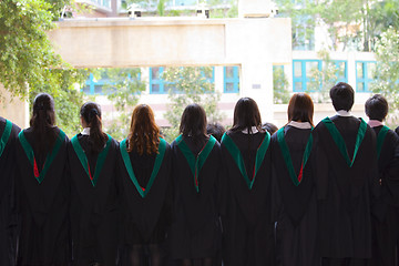 Image showing Back of university graduates with their gowns