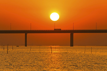 Image showing Sunset over a bridge in Hong Kong