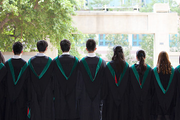 Image showing Back of university graduates with their gowns