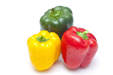 Image showing Bell peppers (green, yellow and red) isolated on white backgroun