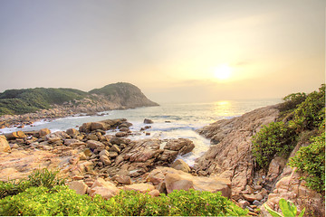 Image showing Sea stones along the coast at sunrise