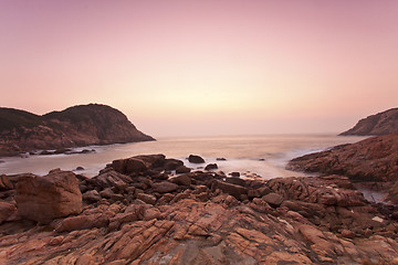 Image showing Sea stones along the coast at sunrise