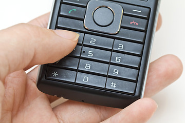 Image showing Hand using cellphone