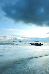 Image showing A boat in the sea with thunderstorm coming