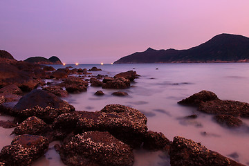 Image showing Sunset along the coast. Nature composition under long exposure.