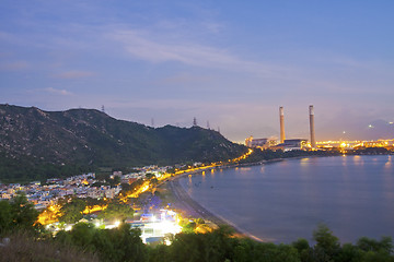 Image showing Power station along the seashore at night 