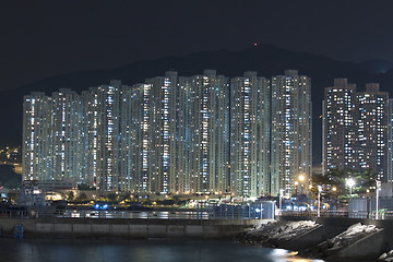 Image showing Hong Kong apartment blocks at night, showing the packed conditio