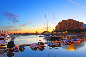 Image showing Yacht pier at sunset time under long exposure in Hong Kong, Gold