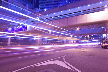 Image showing Busy night traffic in business district of modern city