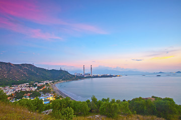 Image showing Power station along the seashore at sunset time
