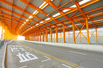 Image showing Orange tunnel and highway at day