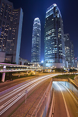 Image showing Busy night traffic in business district of modern city