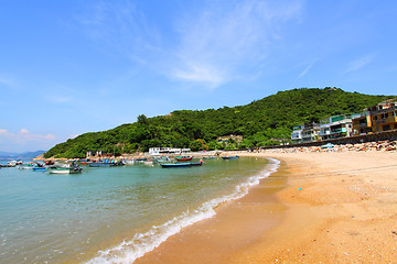 Image showing Beach in Hong Kong with many boats and houses
