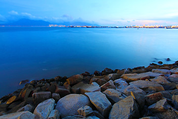 Image showing Sunset along the coast in Hong Kong with rocks