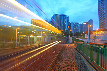 Image showing Traffic in Hong Kong at night. Light rail.