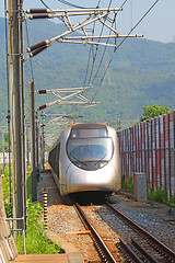 Image showing Fast train with passengers in Hong Kong at day