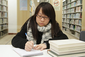 Image showing Asian girl studying in library