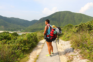 Image showing Asian man hiking at summer time