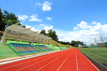 Image showing Stadium chairs and running tracks