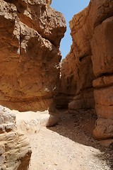 Image showing Narrow slot between two rocks in desert canyon