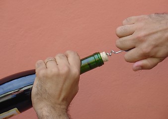 Image showing pulling the cork of the wine bottle