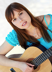 Image showing Woman playing guitar